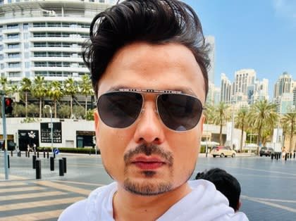 Vivek Tirpude in sunglasses on a city street, before his surgery