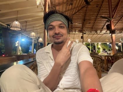 Vivek Tirpude smiling at an evening gathering, before his surgery