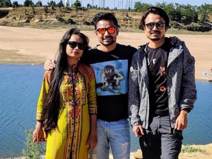 Vivek Tirpude with family on an outing by a lake, before his surgery